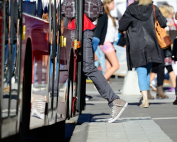 Person enters bus