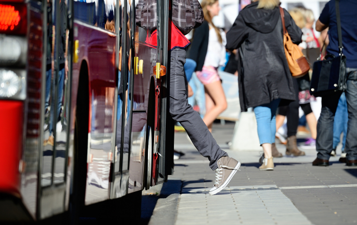 Person enters bus